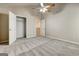 Neutral bedroom with closet and adjacent room. Comfortable carpeting and ceiling fan at 737 Shadow Lake Dr, Lithonia, GA 30058