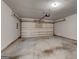 Spacious two car garage with an automatic door and concrete flooring at 737 Shadow Lake Dr, Lithonia, GA 30058