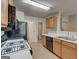 Kitchen with a view to other rooms, featuring essential appliances and functional counter space at 737 Shadow Lake Dr, Lithonia, GA 30058