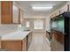 Well-lit kitchen with dining room view, showcasing modern appliances and efficient design elements at 737 Shadow Lake Dr, Lithonia, GA 30058