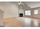 Bright living room with fireplace, tall ceilings, and natural light creates an inviting and airy atmosphere at 737 Shadow Lake Dr, Lithonia, GA 30058