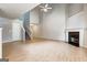 Bright, open living area with a tall ceiling, fireplace, and hardwood floors at 737 Shadow Lake Dr, Lithonia, GA 30058