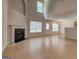 Spacious living area with fireplace and light hardwood floors, bathed in natural light at 737 Shadow Lake Dr, Lithonia, GA 30058