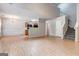 Open living space featuring hardwood floors, stairs, dining area and natural light at 737 Shadow Lake Dr, Lithonia, GA 30058