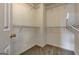 Walk-in closet with carpet and plenty of shelving for storage at 737 Shadow Lake Dr, Lithonia, GA 30058