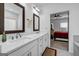 Bathroom featuring dual sinks, quartz countertops, and plenty of natural light at 4565 Sims Park Overlook, Suwanee, GA 30024