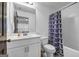 Bathroom featuring a white vanity, patterned shower curtain, and tub at 4565 Sims Park Overlook, Suwanee, GA 30024