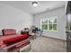 Bright bedroom with a desk area, plush carpet, and a patterned bedspread at 4565 Sims Park Overlook, Suwanee, GA 30024