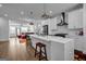 Spacious kitchen with a large island, stainless steel appliances, and modern finishes at 4565 Sims Park Overlook, Suwanee, GA 30024