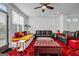 Bright living room with large windows, stylish furnishings, and a modern ceiling fan at 4565 Sims Park Overlook, Suwanee, GA 30024