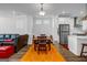 Open living space with dining area, stainless appliances, and comfortable seating arrangements at 4565 Sims Park Overlook, Suwanee, GA 30024