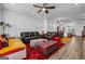 Open-concept living space with modern decor, hardwood floors, and an abundance of natural light at 4565 Sims Park Overlook, Suwanee, GA 30024