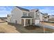 Two-story home with siding, brick accents, well-kept lawn, and a two-car garage at 162 Aster Ave, Locust Grove, GA 30248