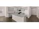 This kitchen features granite countertops, stainless appliances, and an island sink at 162 Aster Ave, Locust Grove, GA 30248