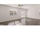 Hardwood floors, a ceiling fan and natural light welcome you into this living area at 162 Aster Ave, Locust Grove, GA 30248