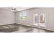 Light-filled living area with hardwood flooring and access to the outdoors at 162 Aster Ave, Locust Grove, GA 30248