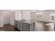 Open-concept living space with a view of the yard and hardwood floors at 162 Aster Ave, Locust Grove, GA 30248