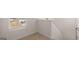 Staircase landing with window and plush carpet at 162 Aster Ave, Locust Grove, GA 30248