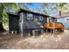 Rear exterior view of home with a wood deck and mature trees at 1336 Mcclelland Ave, Atlanta, GA 30344