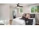 Bright bedroom featuring a ceiling fan, natural light, and modern decor at 1336 Mcclelland Ave, Atlanta, GA 30344