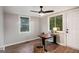 A serene bedroom with hardwood floors is illuminated by natural light, complemented by a ceiling fan and a work desk at 1336 Mcclelland Ave, Atlanta, GA 30344