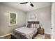 Cozy bedroom features neutral decor, a comfortable bed with stylish pillows, and a ceiling fan at 1336 Mcclelland Ave, Atlanta, GA 30344