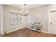 A dining room with a large window, modern lighting, and a convenient bar cart at 1336 Mcclelland Ave, Atlanta, GA 30344