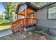 Side view of craftsman-style home with wooden porch and meticulous landscaping at 1336 Mcclelland Ave, Atlanta, GA 30344