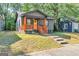 Attractive bungalow-style house with a yellow front door and manicured lawn at 1336 Mcclelland Ave, Atlanta, GA 30344