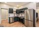 Stylish kitchen with stainless steel appliances and dark blue cabinets at 1336 Mcclelland Ave, Atlanta, GA 30344