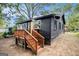 Rear view of home featuring a wooden deck and dark colored siding at 1336 Mcclelland Ave, Atlanta, GA 30344