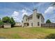 Spacious backyard featuring a large grassy area, wood fence, and a storage shed at 823 Hennepin Ter, Mcdonough, GA 30253