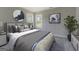 Nicely decorated bedroom featuring natural light, calm decor, and a comforting atmosphere at 823 Hennepin Ter, Mcdonough, GA 30253
