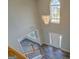View from the second floor balcony highlighting the foyer with chandelier and front door at 823 Hennepin Ter, Mcdonough, GA 30253