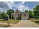 Lovely two-story brick home with mature trees, a well-manicured lawn, and a two car garage at 823 Hennepin Ter, Mcdonough, GA 30253