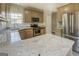 Bright kitchen with granite countertops, stainless steel appliances, and modern fixtures at 823 Hennepin Ter, Mcdonough, GA 30253