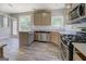 Kitchen featuring stainless steel appliances, granite countertops, pantry, and open layout at 823 Hennepin Ter, Mcdonough, GA 30253