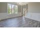 Open-concept living room with modern lighting and new flooring at 823 Hennepin Ter, Mcdonough, GA 30253