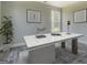 Bright and airy office space with a modern white desk, stylish decor, and wood-look flooring at 823 Hennepin Ter, Mcdonough, GA 30253