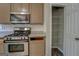 Kitchen with a pantry and stainless steel appliances at 823 Hennepin Ter, Mcdonough, GA 30253