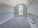 Bright walk-in closet with metal shelving and an arched window providing plenty of natural light at 823 Hennepin Ter, Mcdonough, GA 30253