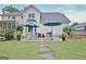 Backyard featuring an outdoor seating area, lush lawn and a well-maintained patio for entertaining at 207 Tiverton Trl, Peachtree City, GA 30269