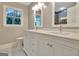Bathroom with a double vanity, quartz counters, and chrome fixtures at 207 Tiverton Trl, Peachtree City, GA 30269