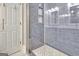 Modern bathroom with a glass-enclosed shower featuring gray subway tile at 207 Tiverton Trl, Peachtree City, GA 30269