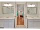 Bathroom with dual vanities and a doorway that offers a peek into the relaxing sitting area at 207 Tiverton Trl, Peachtree City, GA 30269