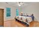 Bright bedroom with hardwood floors, two windows and a ceiling fan at 207 Tiverton Trl, Peachtree City, GA 30269