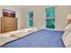 Spacious bedroom with a large window, dresser and flat screen television at 207 Tiverton Trl, Peachtree City, GA 30269