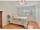 Cozy bedroom with wood floors, ceiling fan and sunlit window at 207 Tiverton Trl, Peachtree City, GA 30269