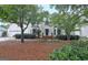 Charming two-story home featuring lush landscaping, brick accents, and an attached garage at 207 Tiverton Trl, Peachtree City, GA 30269