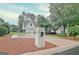 Charming two-story home with a manicured lawn and a driveway leading to an attached garage at 207 Tiverton Trl, Peachtree City, GA 30269